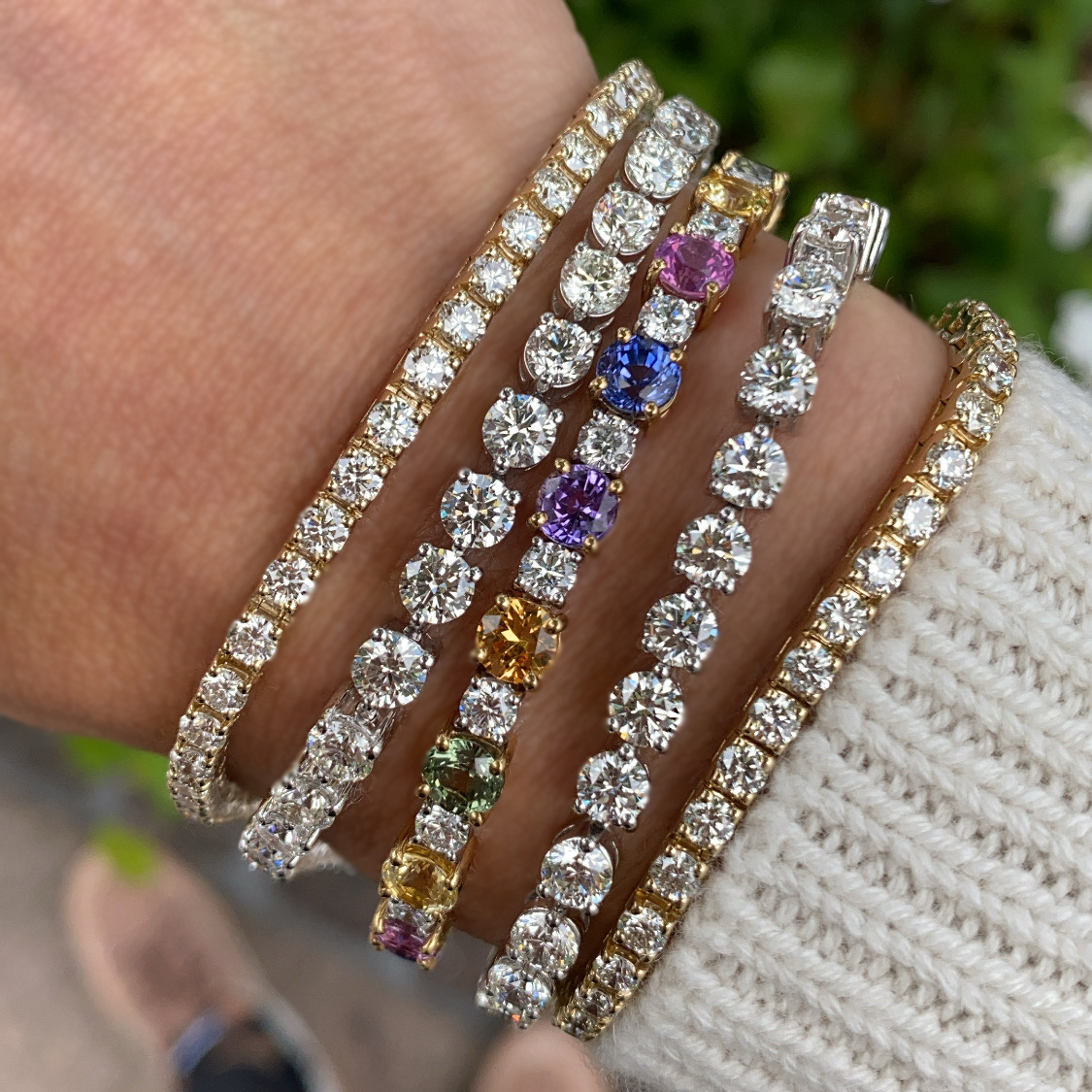 Mixing together diamonds, sapphires and yellow and white gold. A different type of stack, but we like it!