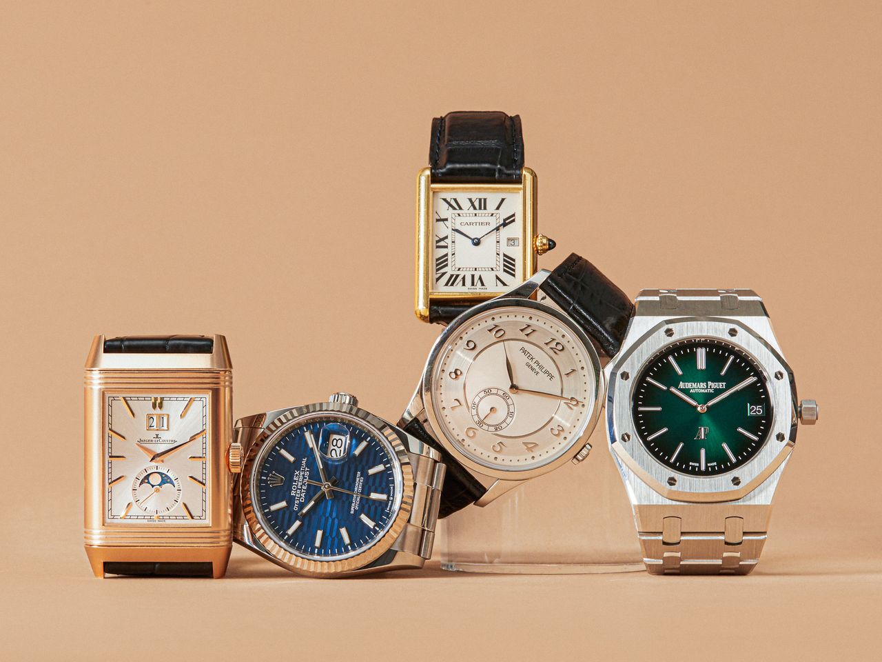 Men's luxury gifting lifestyle imagery with watches, jewelry, and personal objects